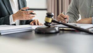 A client meeting with his personal injury lawyer asking him important questions.